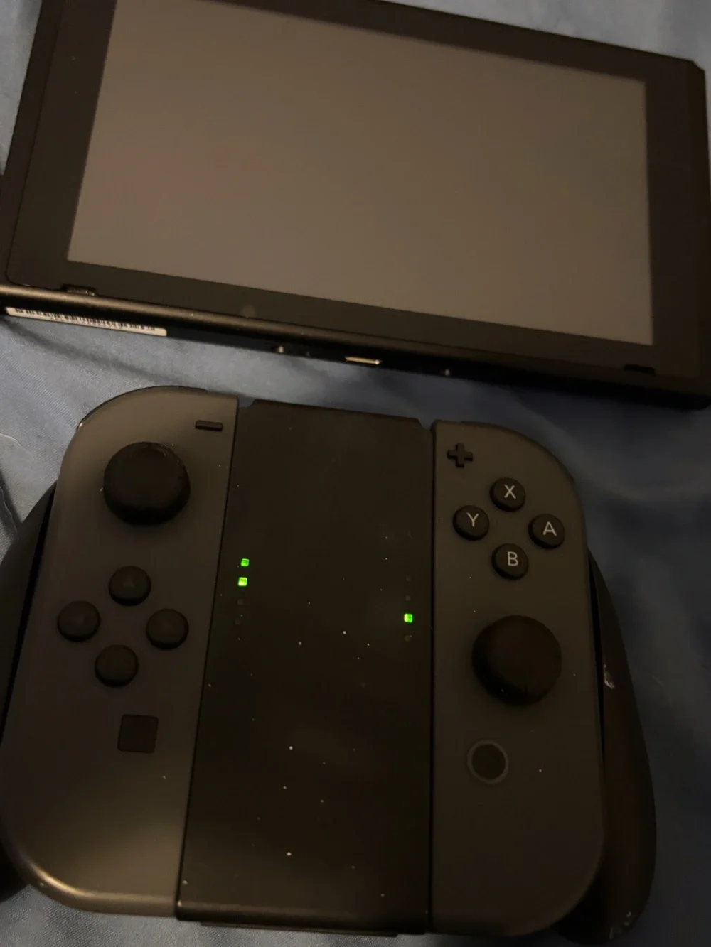 Nintendo Switch Console with Dark Gray Joy‑Con and Black Dock